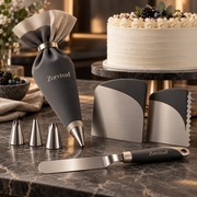 Cake decorating set with dark piping bag, metal tips, spatula, and cake scrapers